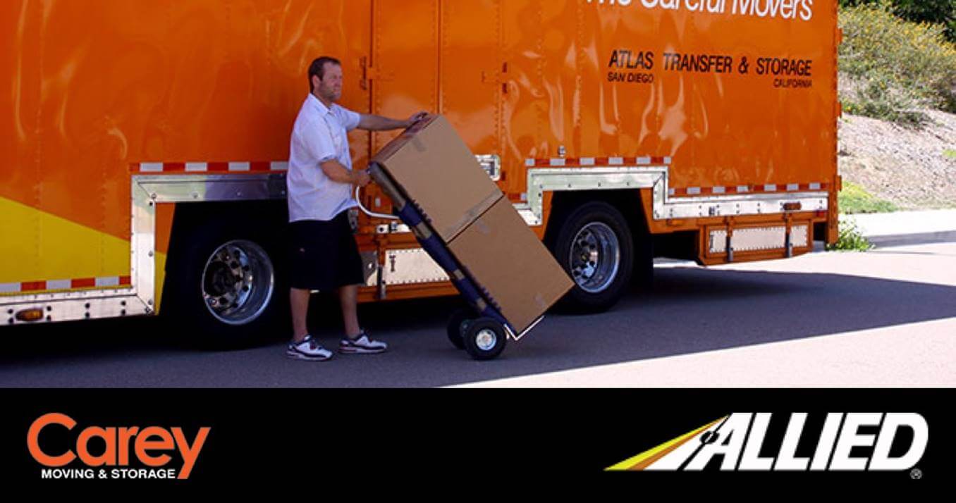 Man moving boxes off truck